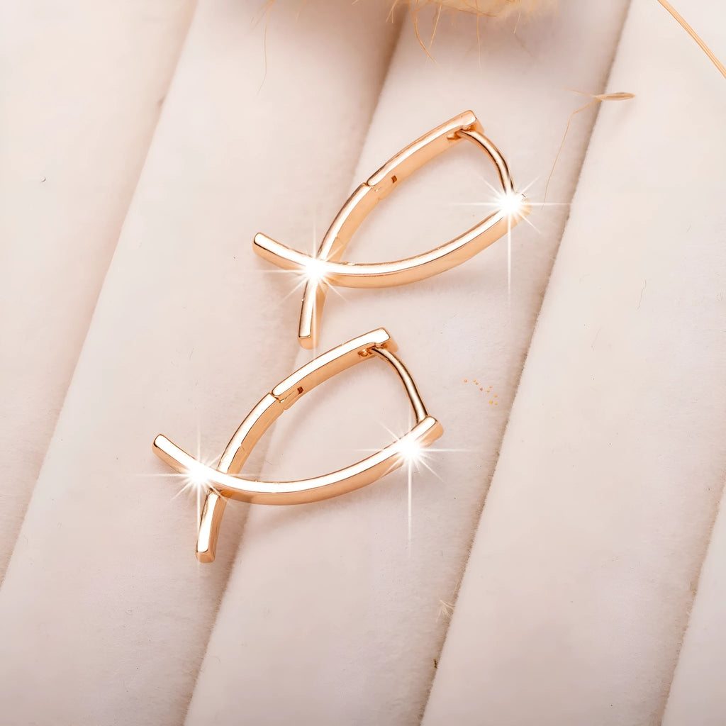 Cross shaped earrings in rose gold colour made from copper material