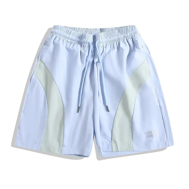 Men's black loose-fit quick-drying sports shorts with elastic waistband on a grey background
