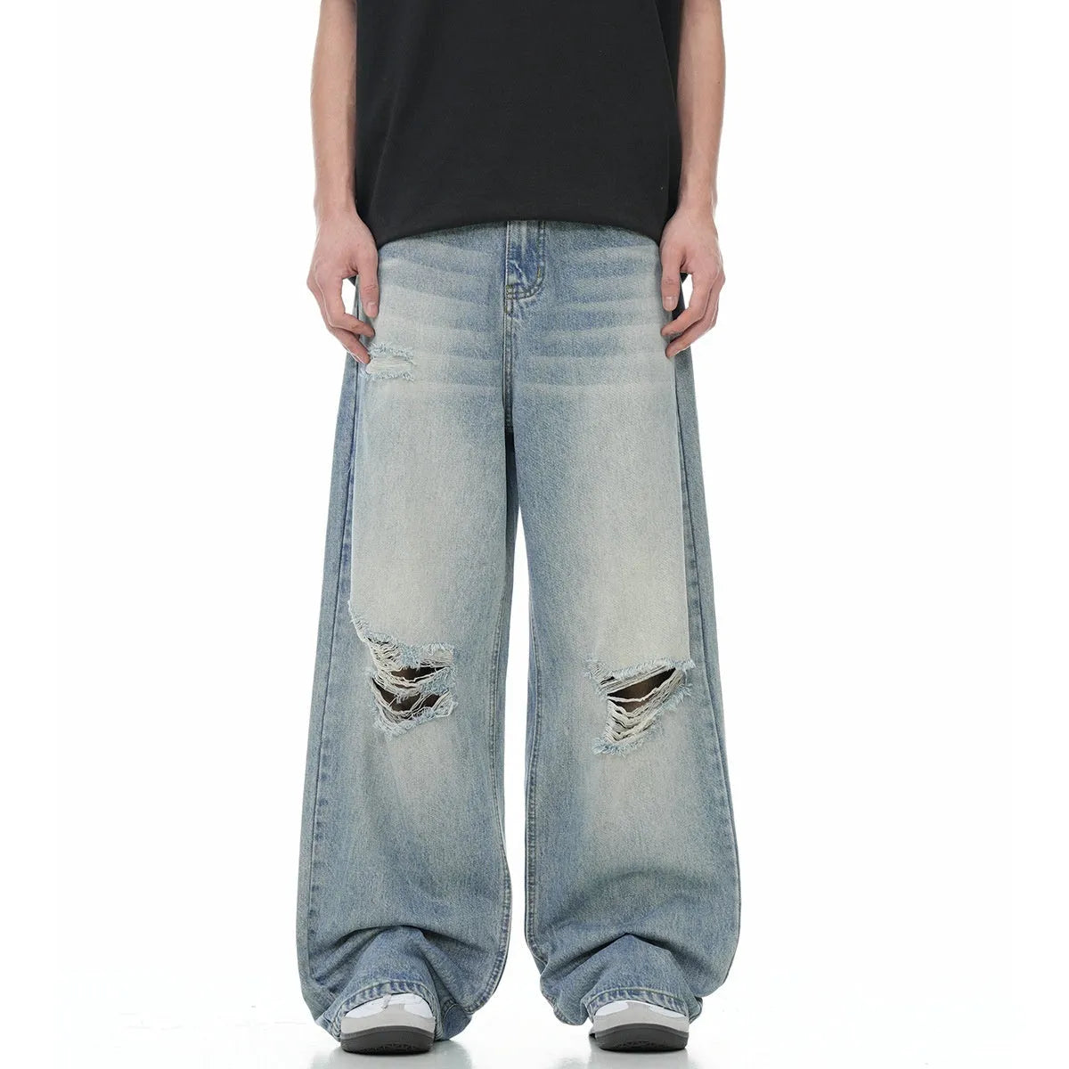 Men's blue straight-leg jeans with ripped details on the legs, showing a zipper fly.