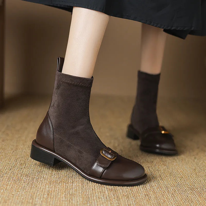 Women's black low heel Martin boots with buckle stitching and front lace-up fastening on a round toe.