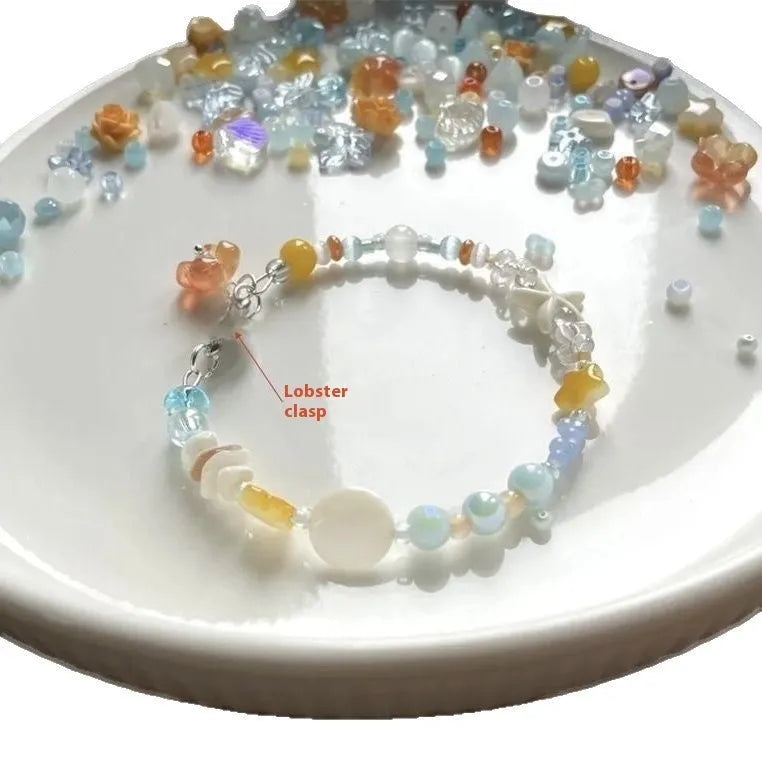 Mixed material alloy bracelet with diamond shape links and round detailing in colour Bracelet 0213