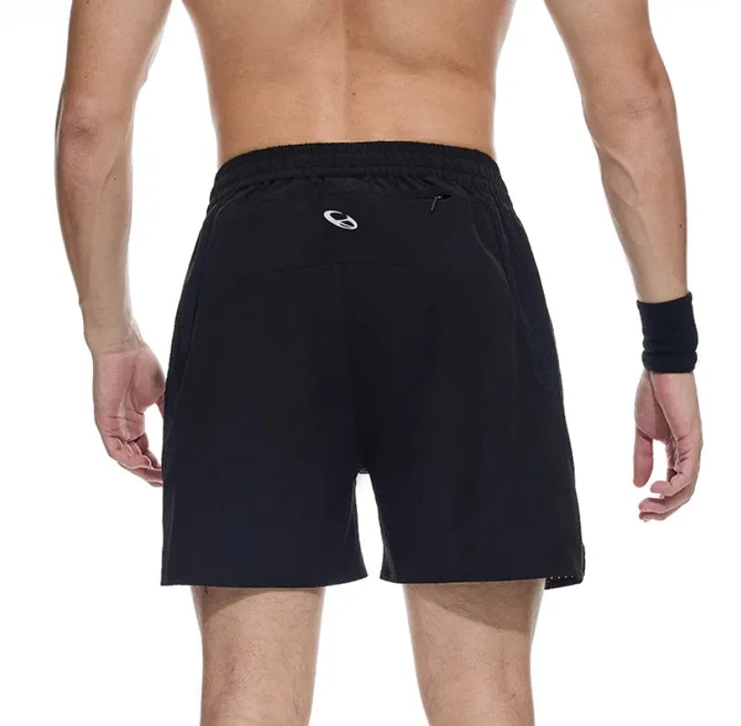 Black and blue four-point running shorts with laser stitching on stretch fabric.