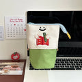 Brown Korean style cartoon print collapsible pencil case with zipper, lying flat.