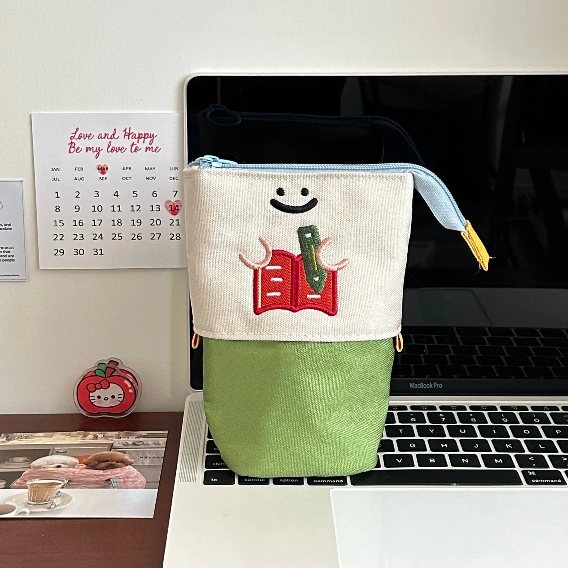 Brown Korean style cartoon print collapsible pencil case with zipper, lying flat.