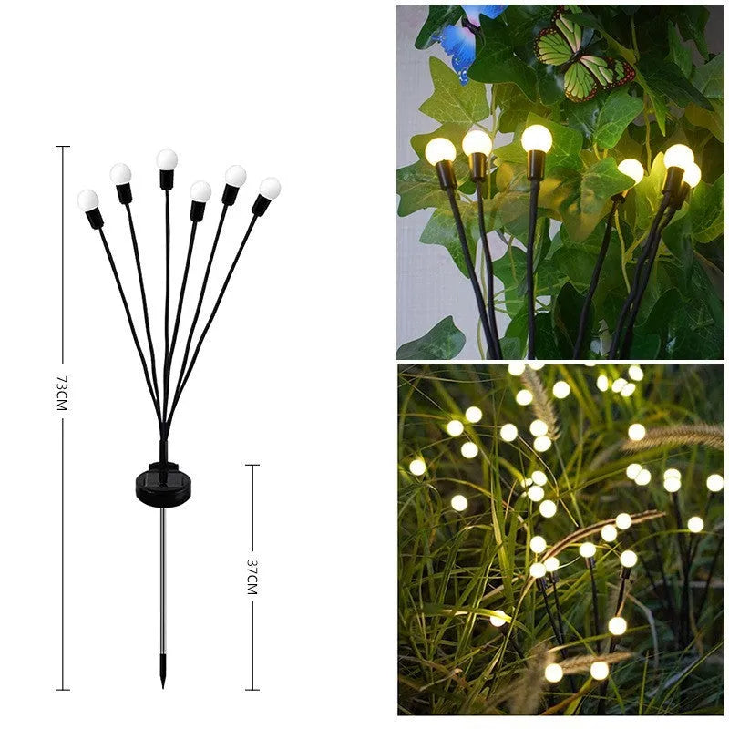 Solar-powered LED ground spike garden light with automatic sensor in lawn