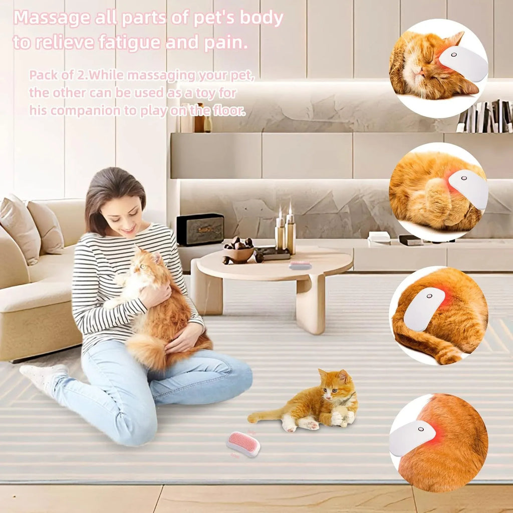 Pink handheld electric pet massage brush with soft white teeth on a table.