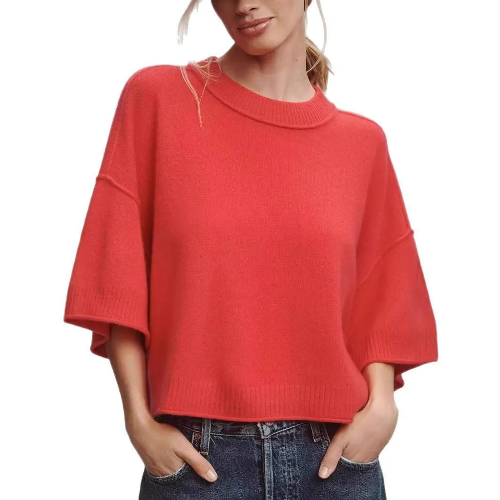 Red cropped short sleeve T-shirt with an exposed navel design on a mannequin.