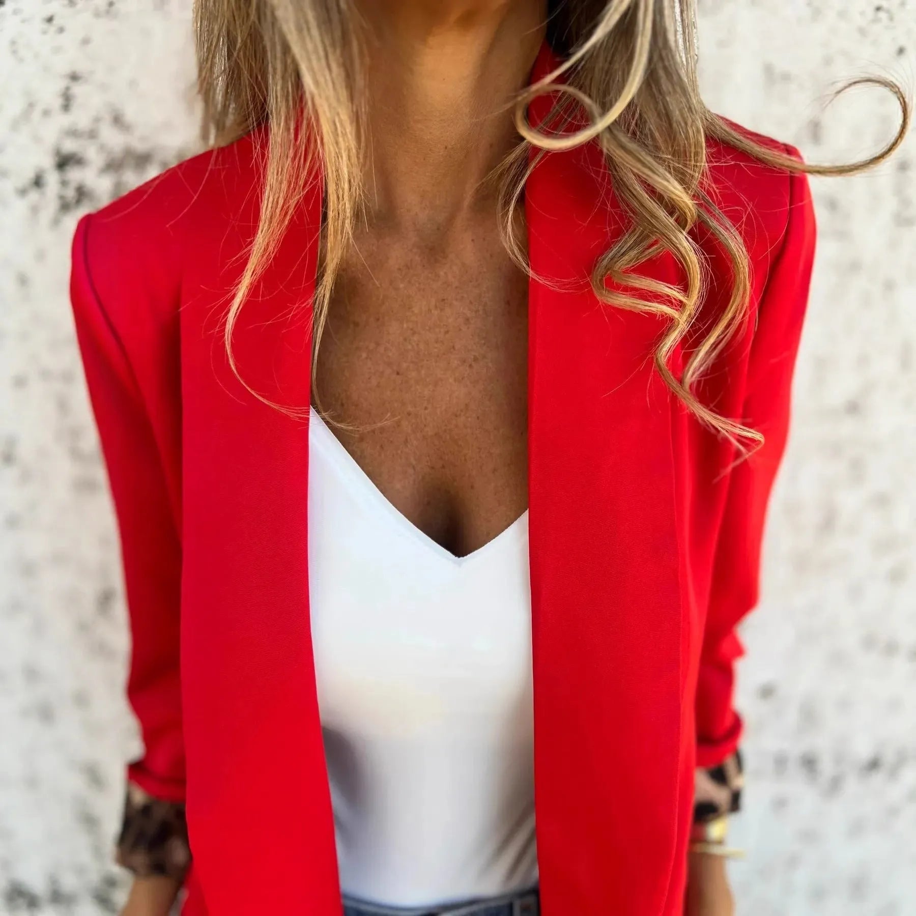 Slim fit black cheetah print blazer with regular sleeves on a hanger