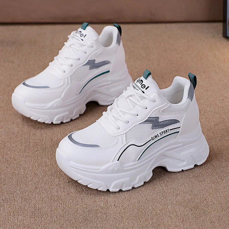 Breathable white and beige women's dad shoes with cross strap and flat rubber sole.