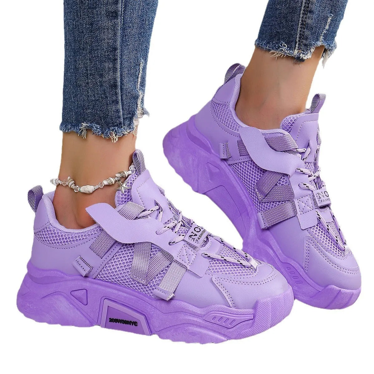 Women's purple mesh platform dad shoes with front lace-up design on a plain background.