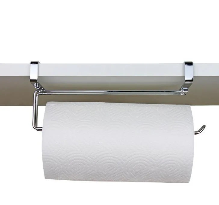 Silver stainless steel paper towel rack hanging over cabinet door for kitchen storage