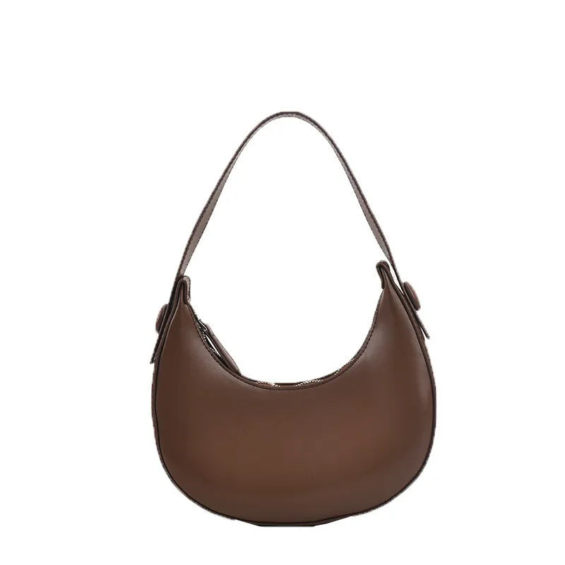 Women's retro PU leather shoulder bag in dumpling shape with zipper pocket, showing cream yellow colour option
