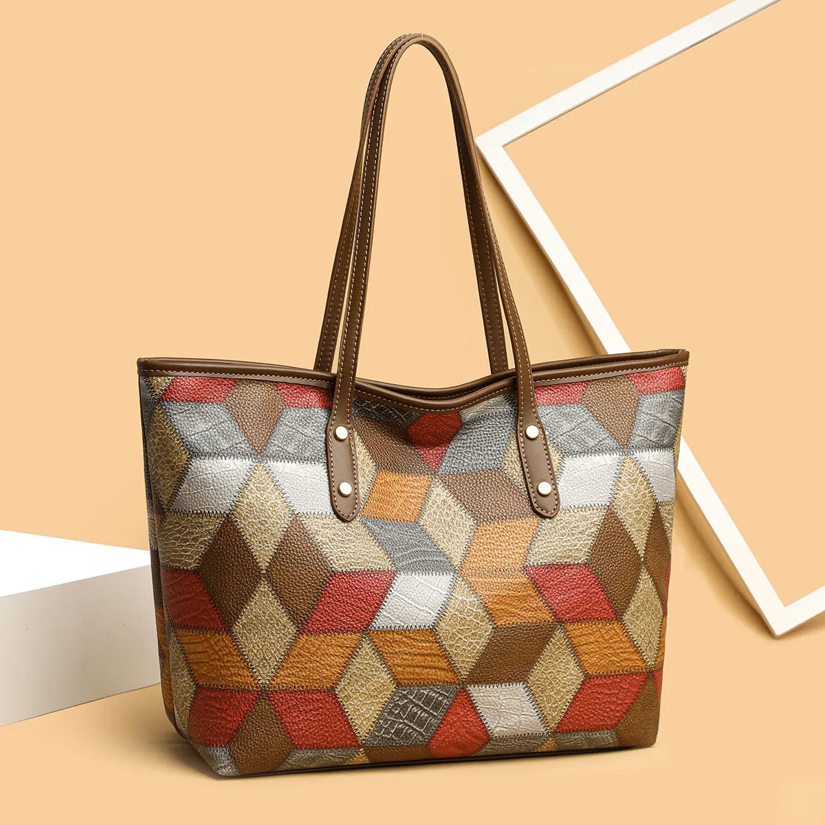 Women's large capacity PVC handbag in blue brown colour with sandwich pocket design and shoulder strap