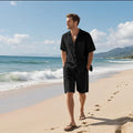 Linen blend short sleeve shirt and shorts beach suit set on a hanger, shown in a light colour.