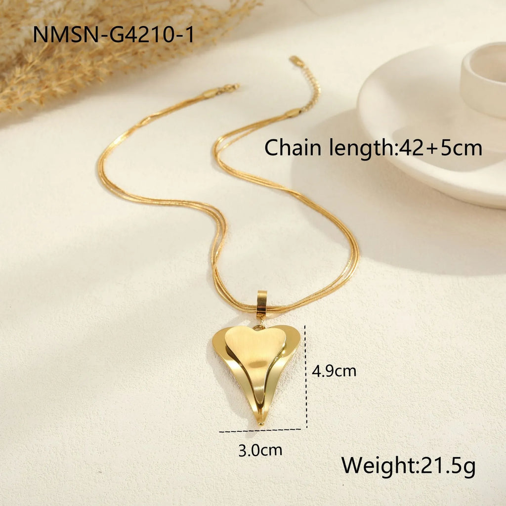 Women's stainless steel necklace with double heart geometric pendant on a snake bones chain in gold or steel finish.