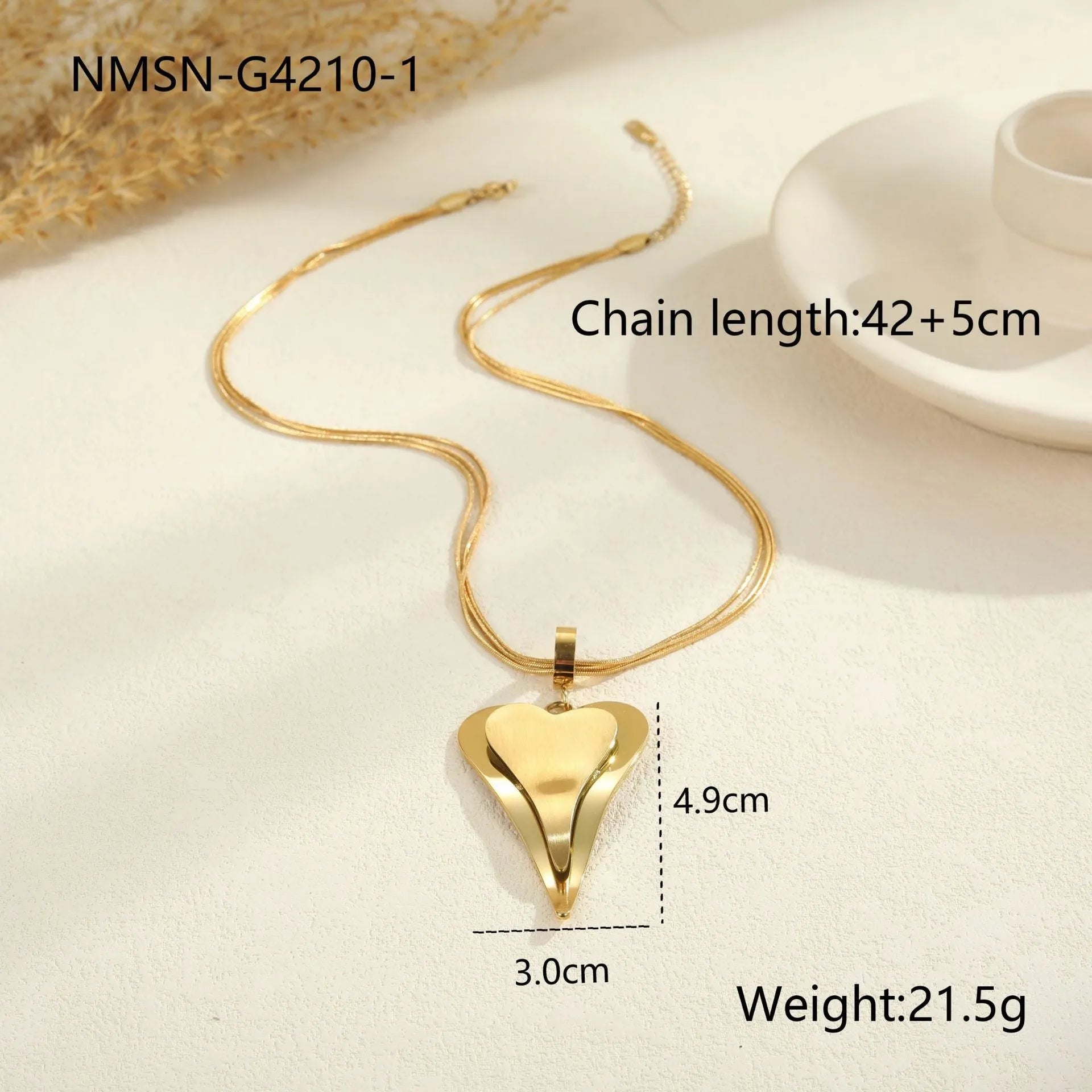 Women's stainless steel necklace with double heart geometric pendant on a snake bones chain in gold or steel finish.
