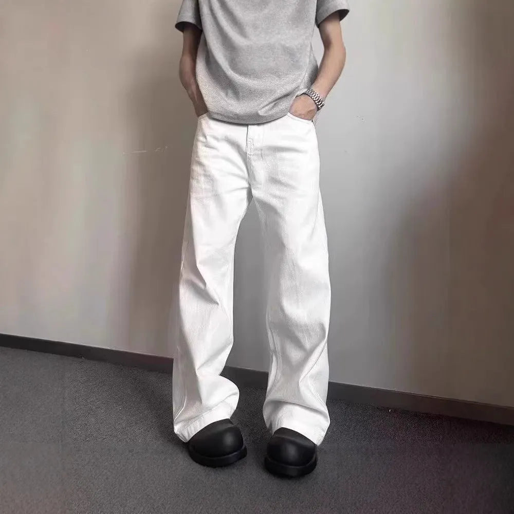 Men's white straight-leg jeans with loose fit and wide leg opening