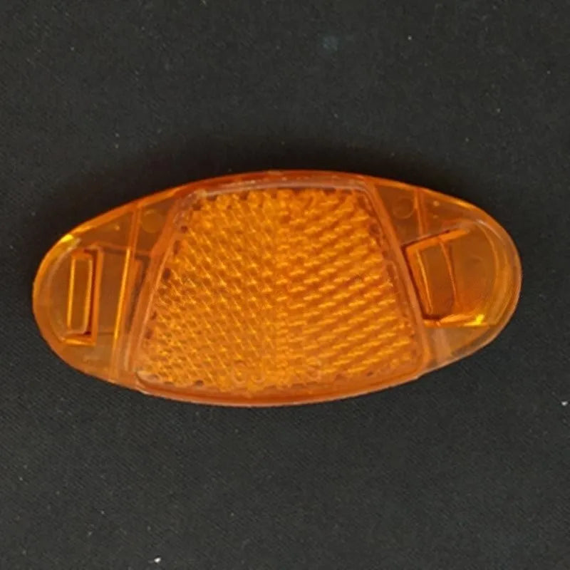 White and yellow plastic bicycle spoke reflector discs for night safety warning