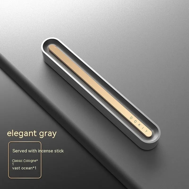 Solid car aromatherapy ornament mounted on air vent with long strip design in metallic grey colour