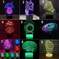 Black remote control LED desk lamp with colourful lighting effects on a wooden desk.