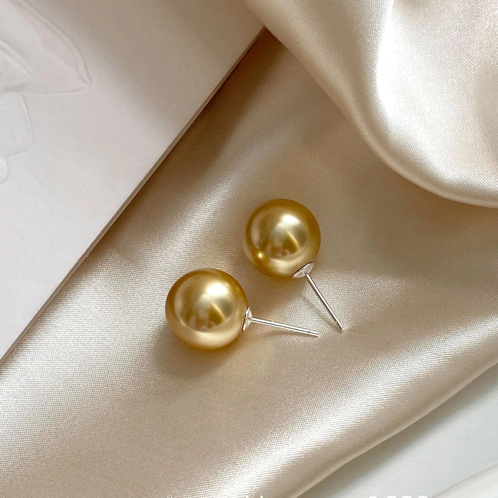 Geometric pearl stud earrings in silver with retro styling and multiple size options
