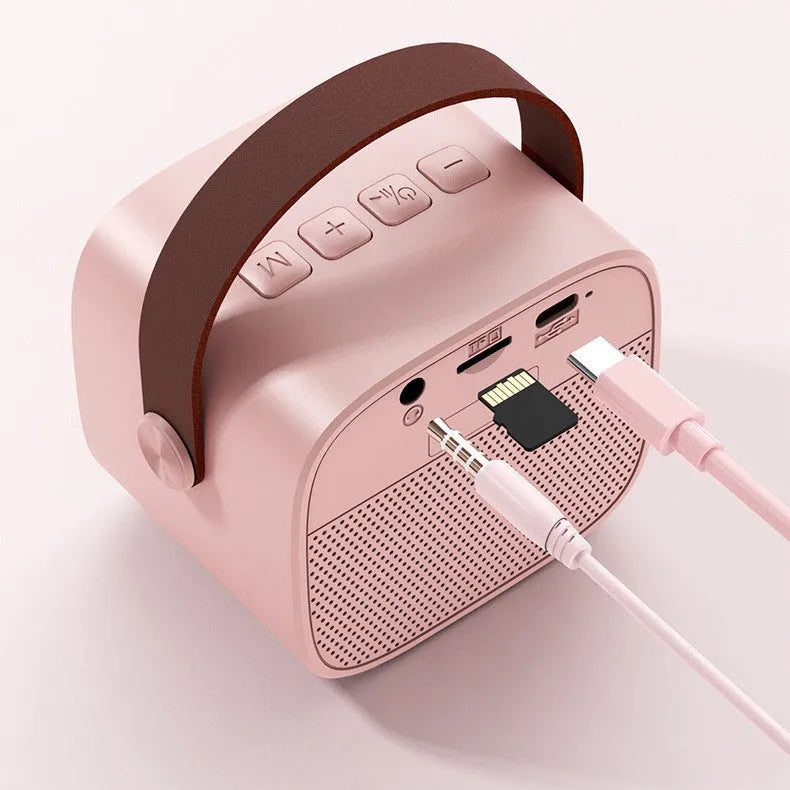 Portable Bluetooth speaker with microphone in white, pink or blue colour options showing compact dimensions