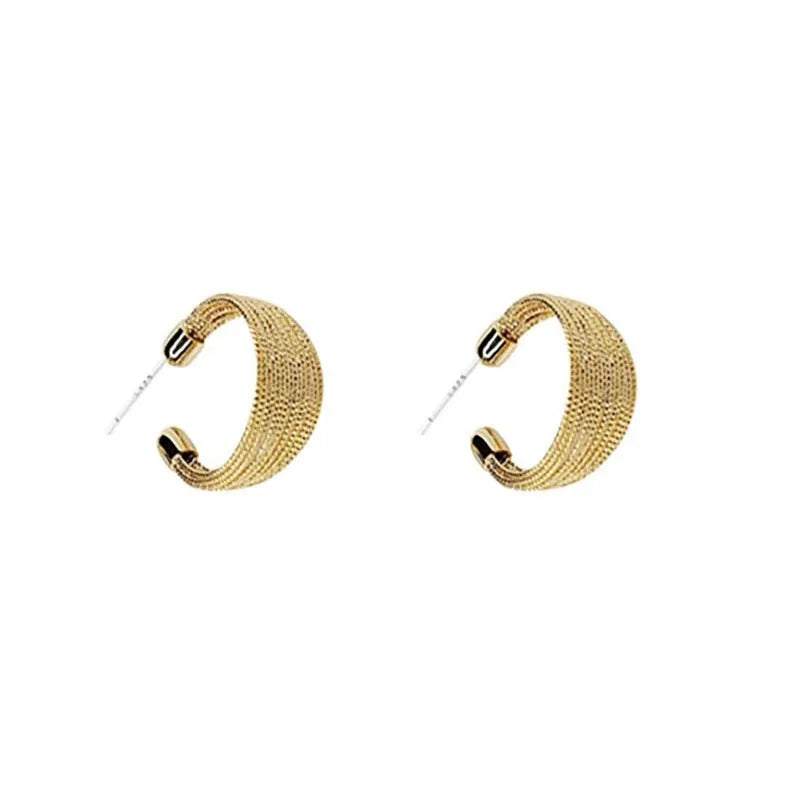 Geometric copper earrings with electroplated silver and gold finishes including stud and clip styles