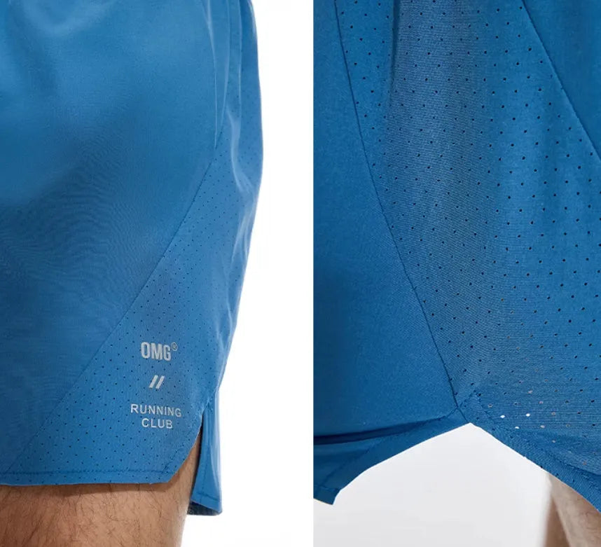 Black and blue four-point running shorts with laser stitching on stretch fabric.