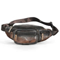 Retro brown leather messenger bag with single shoulder strap shown open.