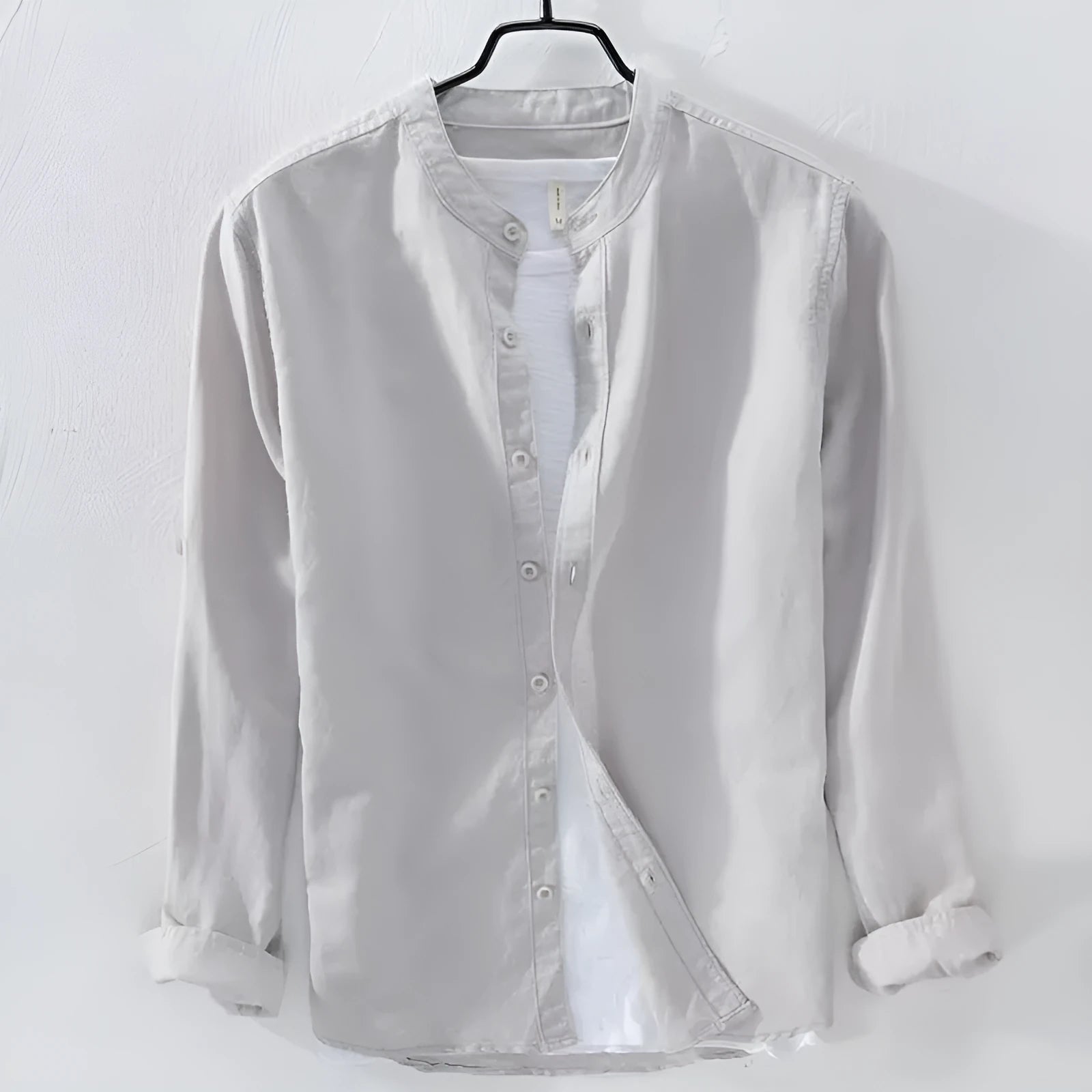Loose fit long sleeve cotton linen shirt in solid colours on a hanger.