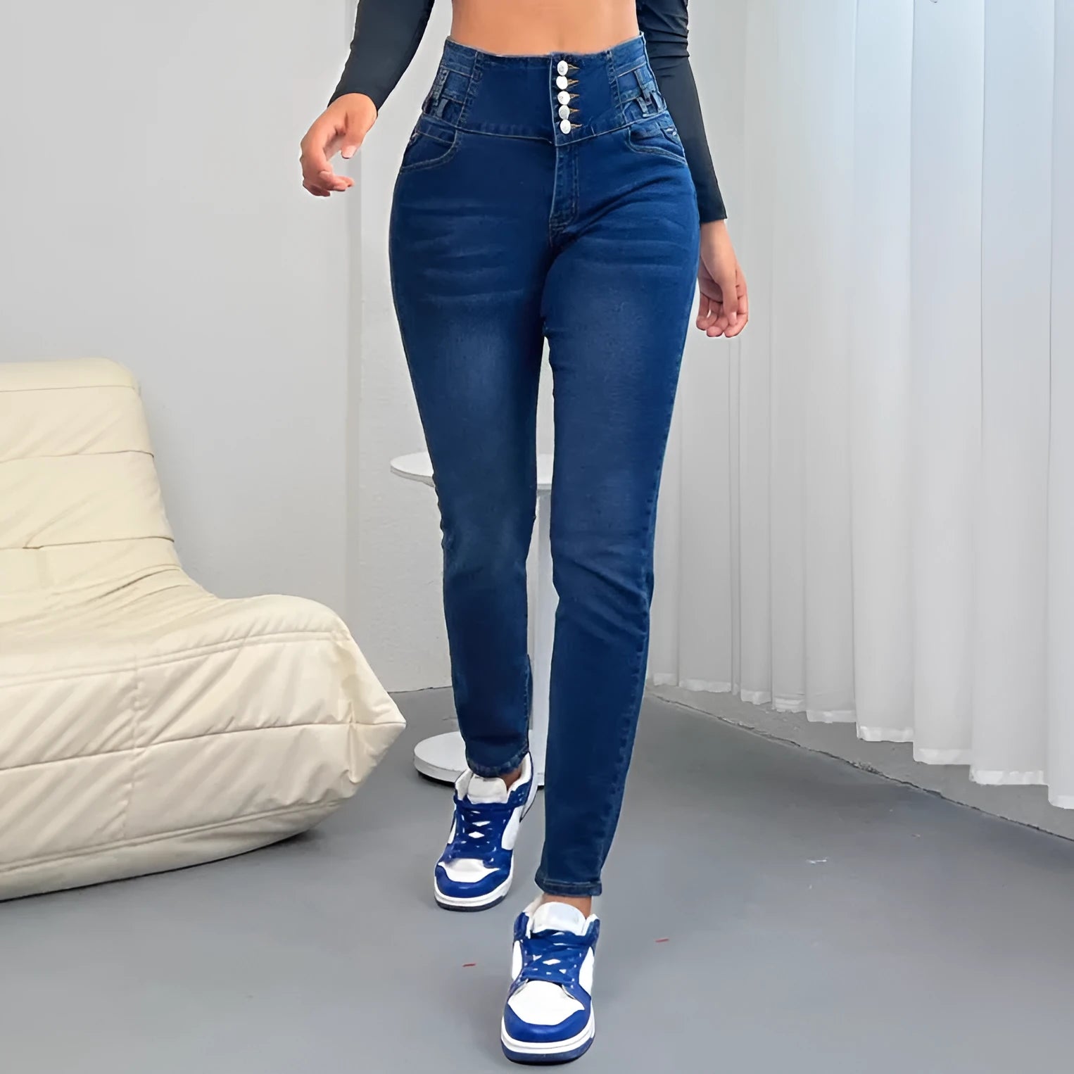 Dark blue women's cotton denim trousers with breasted front and straight-leg skinny fit.