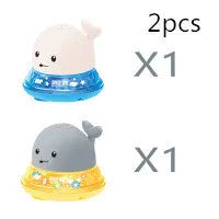 Automatic electric whale bath toy spraying water with flashing coloured lights