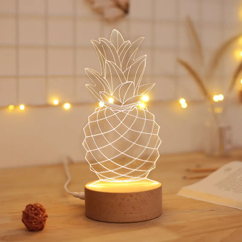 Wood and acrylic pineapple-shaped USB table lamp with dimmer switch on a bedside table.