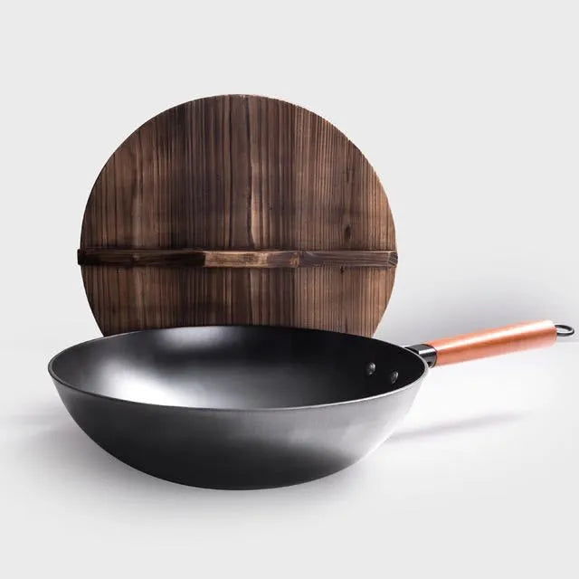 Black traditional iron wok with wooden handle measuring 40cm diameter