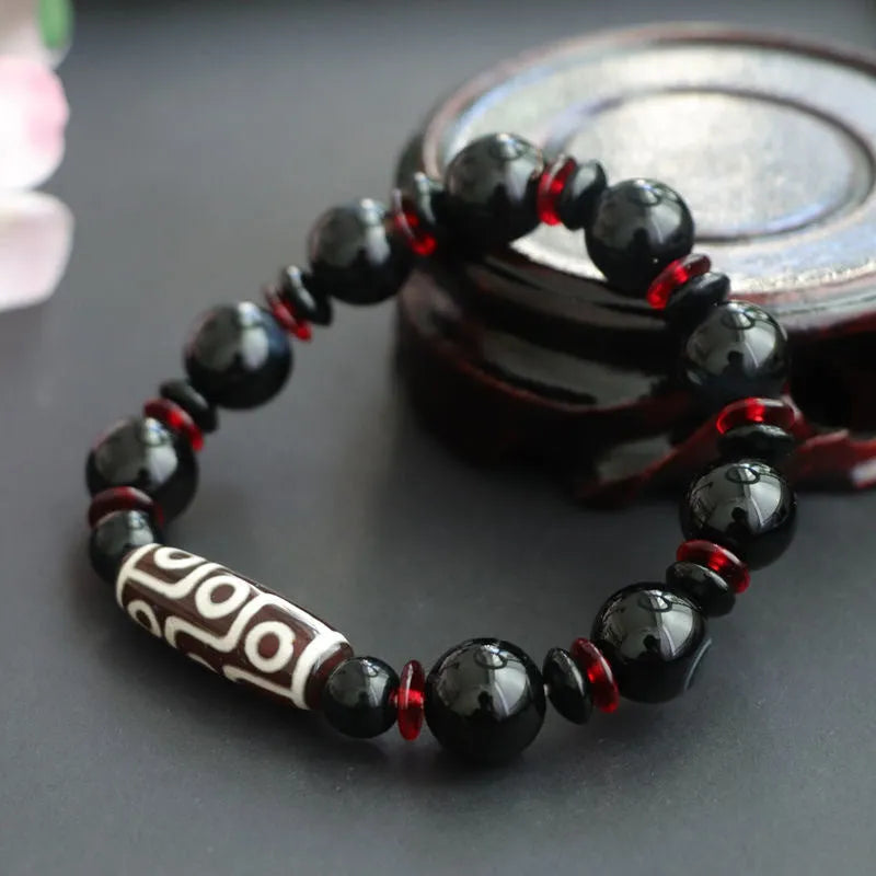 Black agate dzi bead bracelet with 11mm geometry beads and hand-woven construction