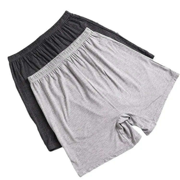 Men's solid colour high-waist modal boxers in black, blue, grey, and brown.