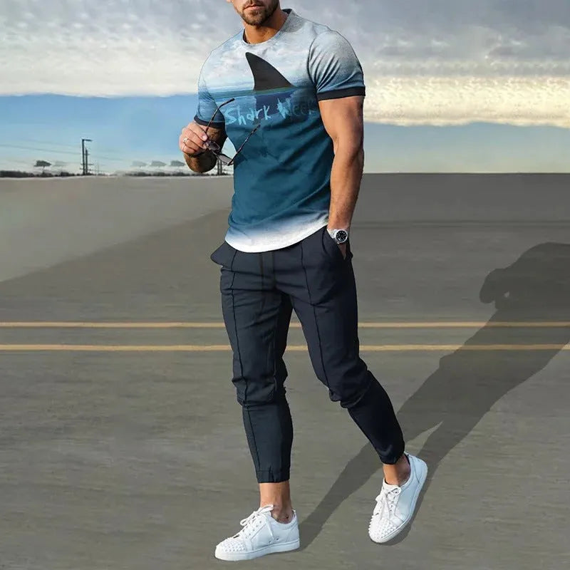 Man modelling a short-sleeved printed pullover and matching trousers from a lightweight polyester sports suit set.