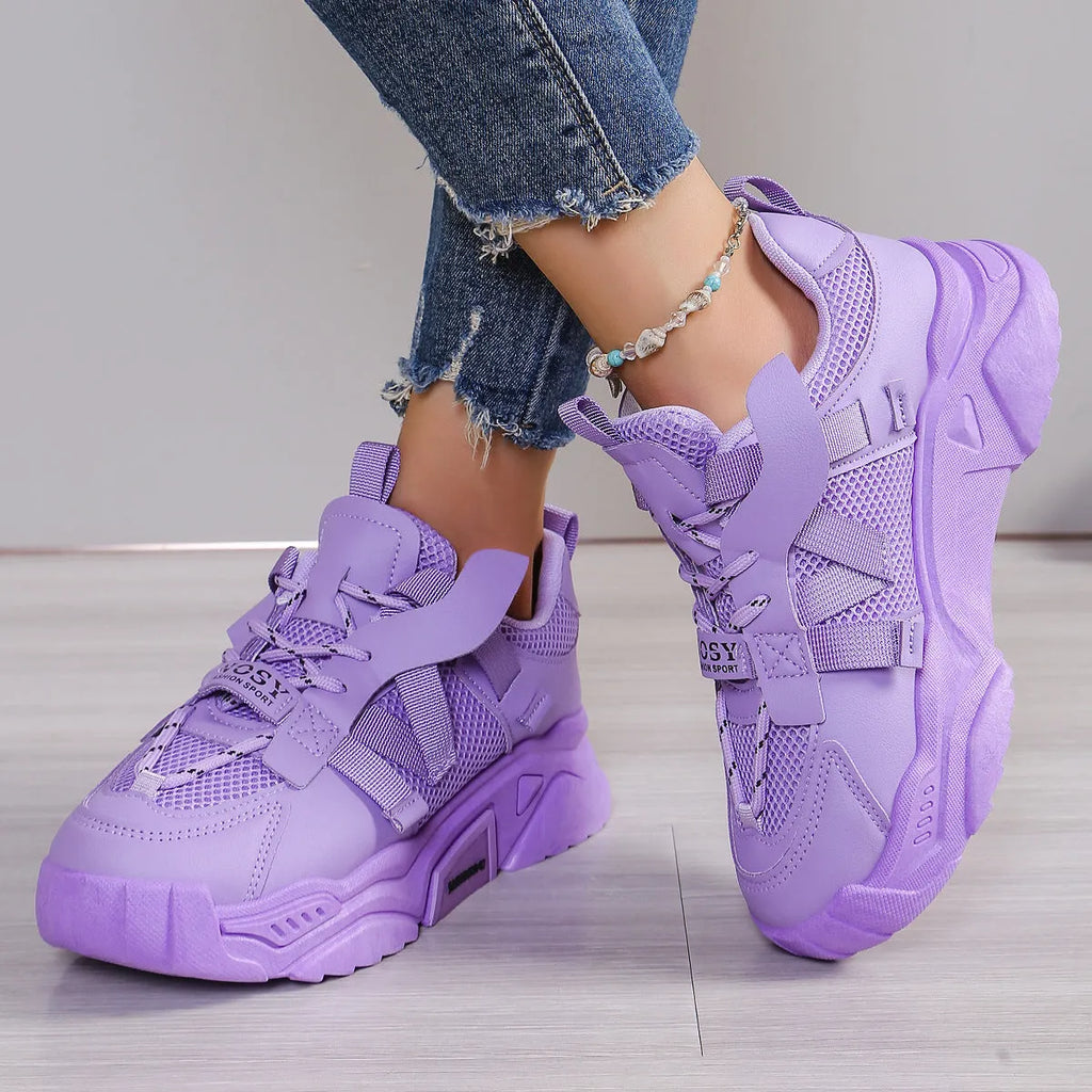 Women's purple mesh platform dad shoes with front lace-up design on a plain background.