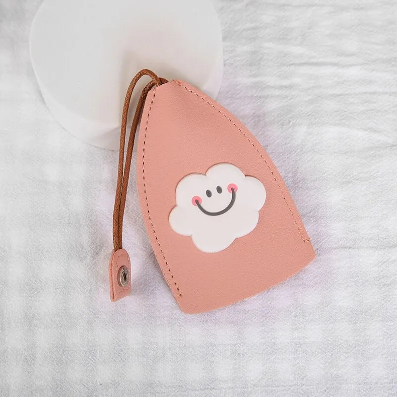 Cartoon patterned pull-out car key case made from PU leather, showing the open design.