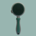 Two-sided silicone cat brush showing retractable slicker side and octopus-teeth massager side