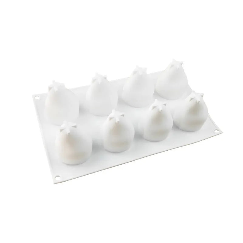Silicone baking mould with six pineapple and pine cone shaped cavities for desserts