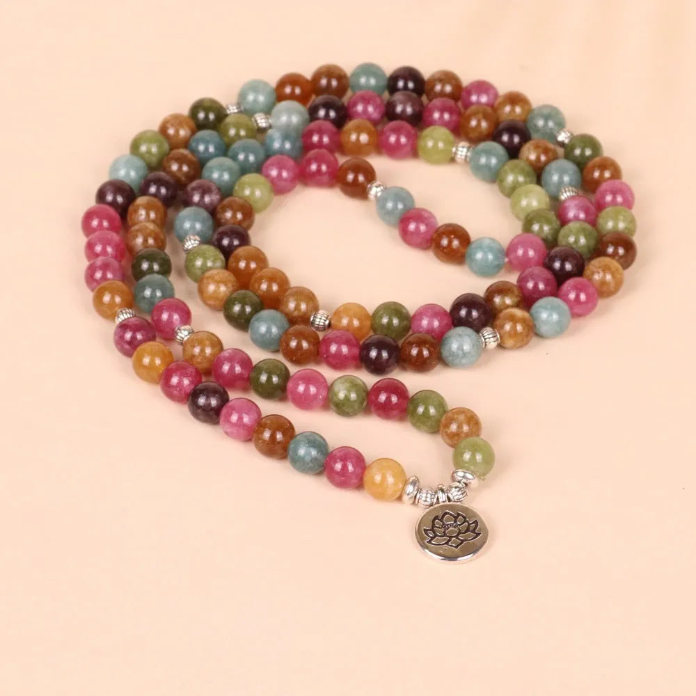 108-bead lotus hanging multi-layer bracelet in tourmaline colour on wrist
