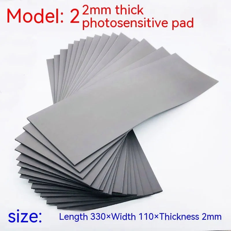 Black and gray plastic light-sensitive mat for seal making measuring 330mm by 110mm