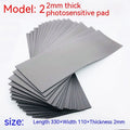 Black and gray plastic light-sensitive mat for seal making measuring 330mm by 110mm