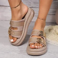 Women's suede upper slippers with thick rubber sole in apricot, black, and off white colours.
