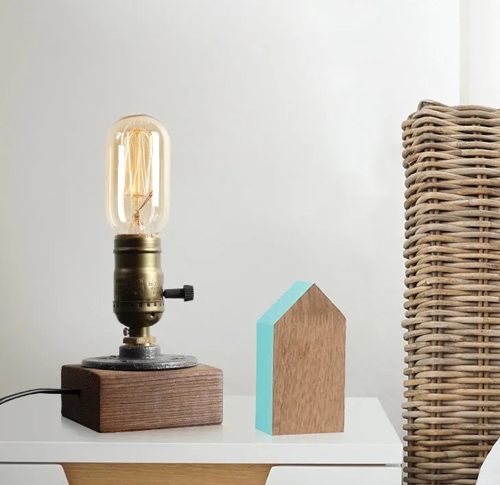 Water pipe table lamp with wood and iron construction measuring 9cm by 13cm
