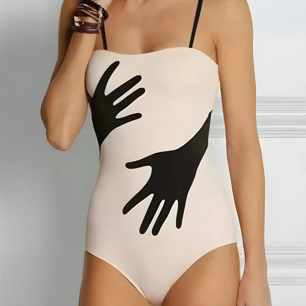 Women's one-piece swimsuit bikini with a sheer gauze skirt overlay.