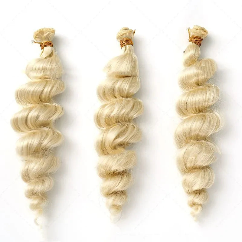 Golden synthetic hair weft wig showing long, straight strands in a golden yellow colour.