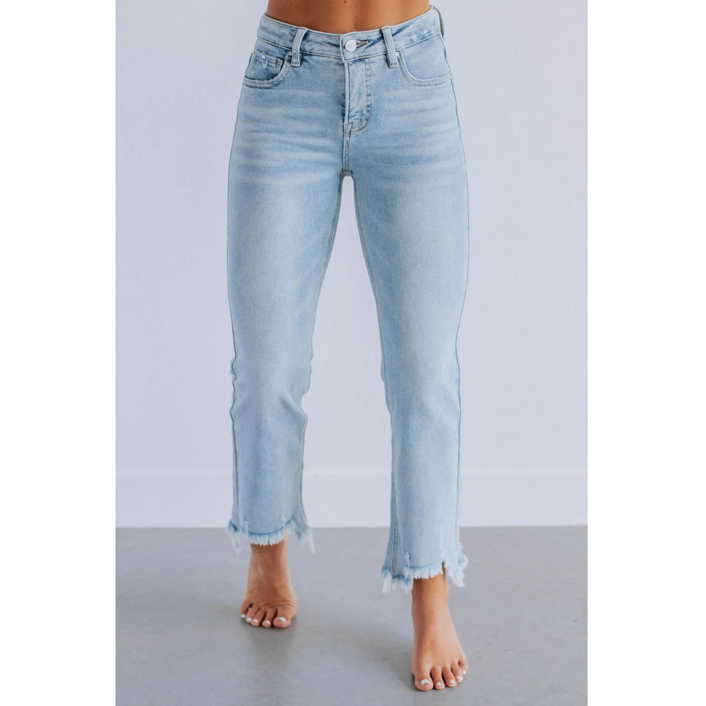 Women's dark blue cotton denim trousers with a hand-distressed casual finish.