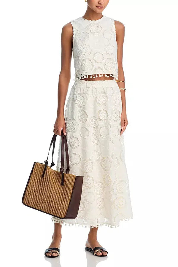 White women's retro art suit with sleeveless top and long skirt featuring embroidery details